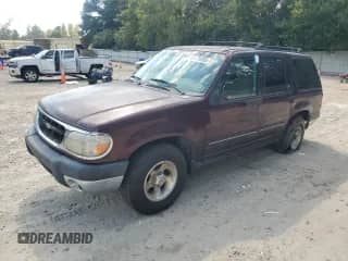 1999 Ford Explorer XL z VIN 1FMDU32E0XUA15144, wystawiony jako Copart lot #81470355 z przebiegiem 174 167 mil mil oraz Szkoda całkowita • Salvage title. Historia ofert i sprzedaży dostępna na DreamBid. Obrazek 1.