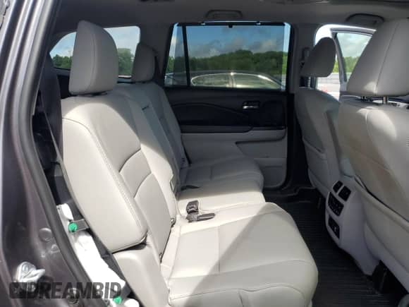 2021 Honda Pilot Touring 8-Passenger z VIN 5FNYF5H92MB037480, wystawiony jako Copart lot #55726545 z przebiegiem 52 910 mil mil oraz Szkoda całkowita • Salvage title. Historia ofert i sprzedaży dostępna na DreamBid. Obrazek 11.