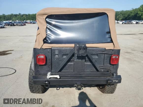 2003 Jeep Wrangler Rubicon с VIN 1J4FA69S23P310588, выставлен на аукционе Copart как лот 66919775 с пробегом 106 685 миль миль и Списание • Salvage title. История ставок и продаж доступна на DreamBid. Изображение 6.