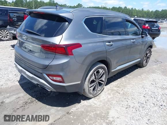 2019 Hyundai Santa Fe Limited with VIN 5NMS53AA8KH019448, listed as a IAAI auction lot 42523814 with 105,414 mi miles and . Bid and sale history available at DreamBid. Image 4.
