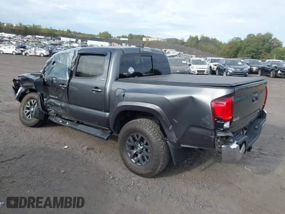 2021 Toyota Tacoma SR with VIN 3TMCZ5AN7MM383352, listed as a IAAI auction lot 43246296 with 44,937 mi miles and . Bid and sale history available at DreamBid. Image 3.