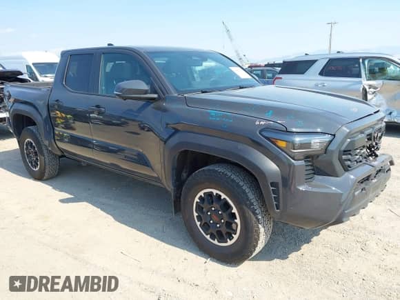 2024 Toyota Tacoma TRD Off Road with VIN 3TMLB5JN7RM069938, listed as a IAAI auction lot 43056789 with 6,837 mi miles and . Bid and sale history available at DreamBid. Image 1.