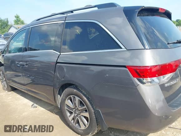 2016 Honda Odyssey Touring Elite z VIN 5FNRL5H97GB034558, wystawiony jako IAAI lot #42862918 z przebiegiem 118 891 mil mil oraz . Historia ofert i sprzedaży dostępna na DreamBid. Obrazek 3.