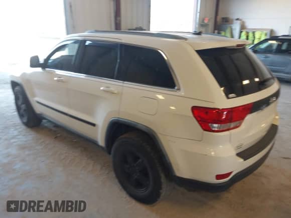 2012 Jeep Grand Cherokee Laredo with VIN 1C4RJFAG8CC141355, listed as a IAAI auction lot 43390830 with 173,259 mi miles and . Bid and sale history available at DreamBid. Image 3.