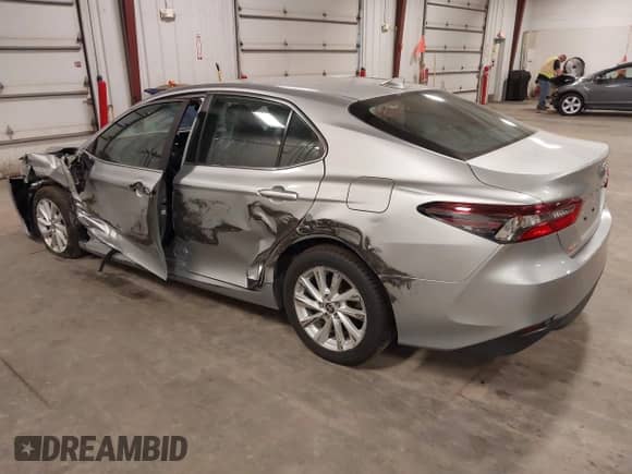 2022 Toyota Camry LE with VIN 4T1C11AK2NU052242, listed as a IAAI auction lot 42943151 with 213,562 mi miles and . Bid and sale history available at DreamBid. Image 3.