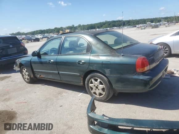 2001 Hyundai Sonata GLS z VIN KMHWF35V11A485934, wystawiony jako Copart lot #69853585 z przebiegiem 120 924 mil mil oraz Szkoda całkowita • Salvage title. Historia ofert i sprzedaży dostępna na DreamBid. Obrazek 2.