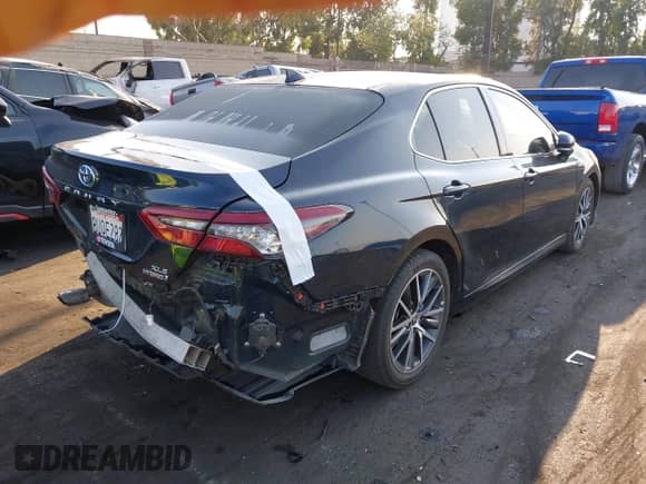 2021 Toyota Camry Hybrid XLE with VIN 4T1F31AK9MU547267, listed as a IAAI auction lot 42732726 with 106,937 mi miles and . Bid and sale history available at DreamBid. Image 4.