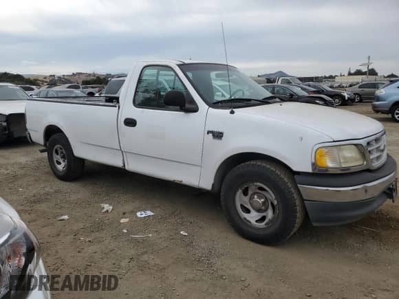 1999 Ford F-150 XL с VIN 1FTRF17L3XKA66147, выставлен на аукционе Copart как лот 69105514 с пробегом 179 426 миль миль и Чистый • Clean title. История ставок и продаж доступна на DreamBid. Изображение 4.