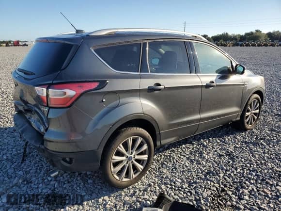 2017 Ford Escape Titanium with VIN 1FMCU9JD9HUE56943, listed as a Copart auction lot 86434385 with 92,098 mi miles and Salvage title. Bid and sale history available at DreamBid. Image 3.