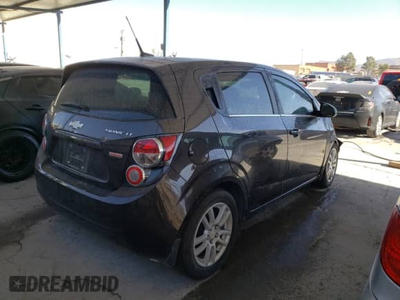 2014 Chevrolet Sonic LT with VIN 1G1JC6SB1E4157803, listed as a Copart auction lot 57115460 with 64,877 mi miles and Salvage title. Bid and sale history available at DreamBid. Image 4.