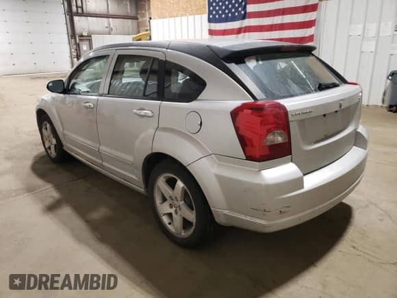 2007 Dodge Caliber R/T with VIN 1B3HE78K67D409143, listed as a Copart auction lot 71726345 with 135,238 mi miles and Salvage title. Bid and sale history available at DreamBid. Image 2.