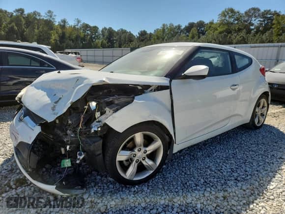 2013 Hyundai Veloster w/Gray Int z VIN KMHTC6AD4DU146162, wystawiony jako Copart lot #84929175 z przebiegiem 143 947 mil mil oraz Szkoda całkowita • Salvage title. Historia ofert i sprzedaży dostępna na DreamBid. Obrazek 1.