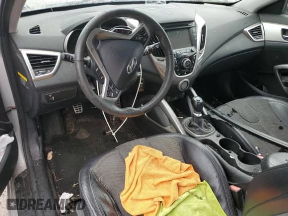 2012 Hyundai Veloster w/Red Int с VIN KMHTC6ADXCU022959, выставлен на аукционе Copart как лот 65585115 с пробегом Не указан миль и Списание • Salvage title. История ставок и продаж доступна на DreamBid. Изображение 8.