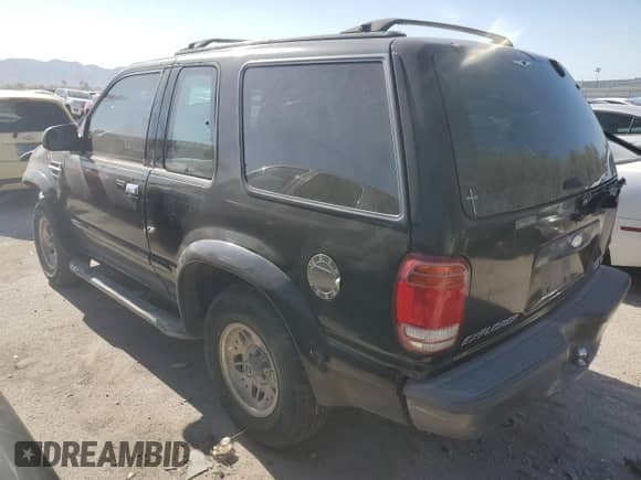 1998 Ford Explorer with VIN 1FMYU22E0WUD43223, listed as a Copart auction lot 64430825 with 180,159 mi miles and Salvage title. Bid and sale history available at DreamBid. Image 2.