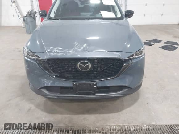 2023 Mazda CX-5 S Carbon Edition z VIN JM3KFBCM8P0261086, wystawiony jako IAAI lot #42215690 z przebiegiem 23 730 mil mil oraz . Historia ofert i sprzedaży dostępna na DreamBid. Obrazek 6.