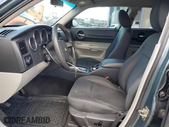 2005 Dodge Magnum SE with VIN 2D4FV48V55H692409, listed as a Copart auction lot 55905624 with 221,676 mi miles and Salvage title. Bid and sale history available at DreamBid. Image 7.