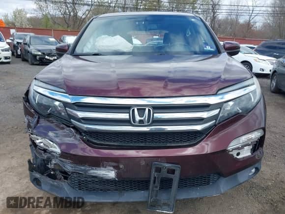 2017 Honda Pilot EX-L with VIN 5FNYF6H74HB040889, listed as a IAAI auction lot 42040094 with 84,001 mi miles and . Bid and sale history available at DreamBid. Image 12.