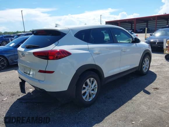 2021 Hyundai Tucson SE with VIN KM8J23A41MU318897, listed as a IAAI auction lot 43233832 with 112,924 mi miles and . Bid and sale history available at DreamBid. Image 4.