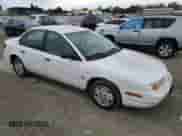 2001 Saturn SL with VIN 1G8ZF52891Z237485, listed as a Copart auction lot 76174574 with 130,525 mi miles and Salvage title. Bid and sale history available at DreamBid. Image 4.