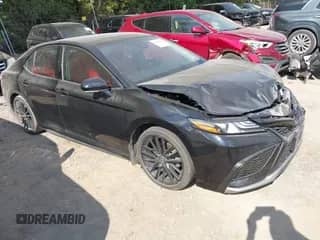 2023 Toyota Camry XSE with VIN 4T1K61AK3PU100136, listed as a IAAI auction lot 43222647 with 77,489 mi miles and . Bid and sale history available at DreamBid. Image 1.