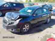 2014 Chevrolet Cruze 1LT z VIN 1G1PC5SB7E7326063, wystawiony jako IAAI lot #43457045 z przebiegiem 134 508 mil mil oraz . Historia ofert i sprzedaży dostępna na DreamBid. Obrazek 2.