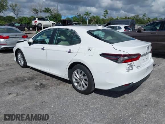 2021 Toyota Camry LE with VIN 4T1C11AK8MU601313, listed as a IAAI auction lot 43383218 with 34,384 mi miles and . Bid and sale history available at DreamBid. Image 3.
