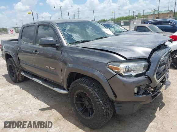 2017 Toyota Tacoma SR5 with VIN 5TFAZ5CN6HX053948, listed as a IAAI auction lot 42843281 with 77,589 mi miles and . Bid and sale history available at DreamBid. Image 1.