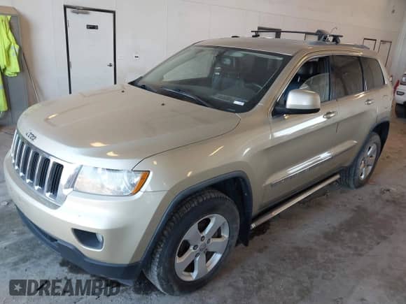 2012 Jeep Grand Cherokee Laredo with VIN 1C4RJFAG8CC153943, listed as a IAAI auction lot 43371764 with 218,266 mi miles and . Bid and sale history available at DreamBid. Image 2.