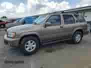 2001 Nissan Pathfinder LE with VIN JN8DR09X11W570874, listed as a Copart auction lot 63546835 with 200,612 mi miles and Salvage title. Bid and sale history available at DreamBid. Image 1.