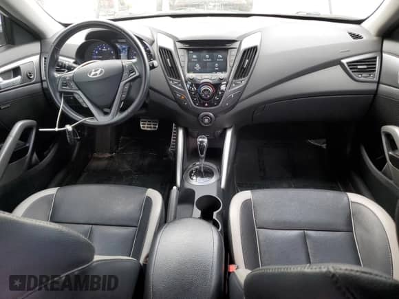 2014 Hyundai Veloster Turbo R-Spec с VIN KMHTC6AE1EU208532, выставлен на аукционе Copart как лот 70159995 с пробегом 75 844 миль миль и Списание • Salvage title. История ставок и продаж доступна на DreamBid. Изображение 8.