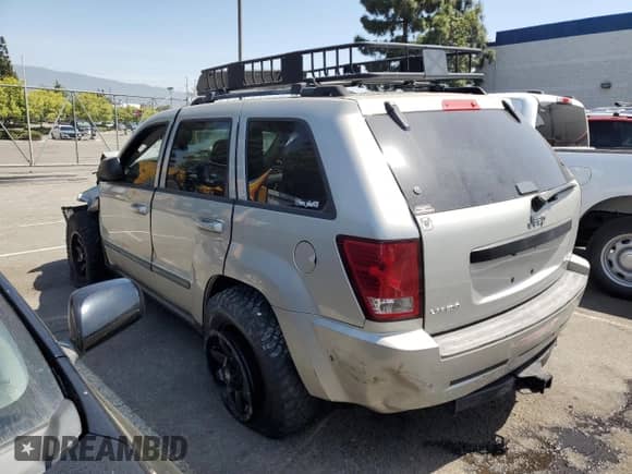 2009 Jeep Grand Cherokee Laredo with VIN 1J8GS48K29C503538, listed as a Copart auction lot 61381754 with 135,759 mi miles and Salvage title. Bid and sale history available at DreamBid. Image 2.