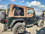 1997 Jeep Wrangler Sport with VIN 1J4FY19S0VP430844, listed as a Copart auction lot 65827275 with 91,868 mi miles and Salvage title. Bid and sale history available at DreamBid. Image 3.