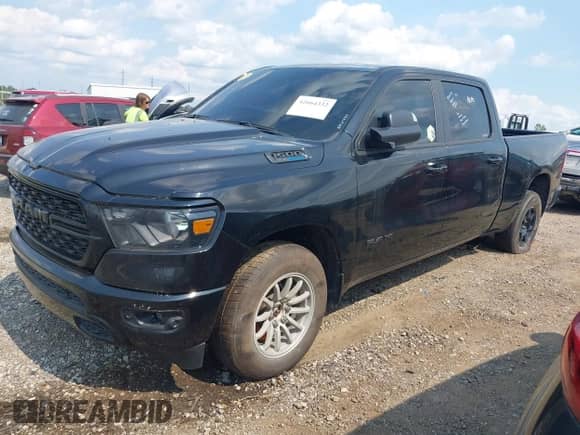 2023 Ram 1500 Big Horn with VIN 1C6SRFMT5PN541779, listed as a IAAI auction lot 42664332 with 21,067 mi miles and . Bid and sale history available at DreamBid. Image 2.