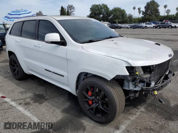 2020 Jeep Grand Cherokee SRT with VIN 1C4RJFDJ1LC366188, listed as a Copart auction lot 55695765 with 35,302 mi miles and Salvage title. Bid and sale history available at DreamBid. Image 4.