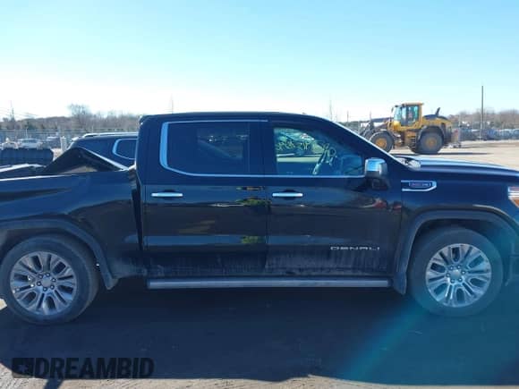 2021 GMC Sierra 1500 Denali with VIN 1GTU9FEL1MZ245338, listed as a IAAI auction lot 41578790 with 53,181 mi miles and . Bid and sale history available at DreamBid. Image 13.