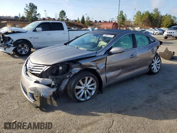 2013 Hyundai Azera с VIN KMHFH4JG6DA312812, выставлен на аукционе Copart как лот 86901174 с пробегом 256 370 миль миль и Списание • Salvage title. История ставок и продаж доступна на DreamBid. Изображение 1.