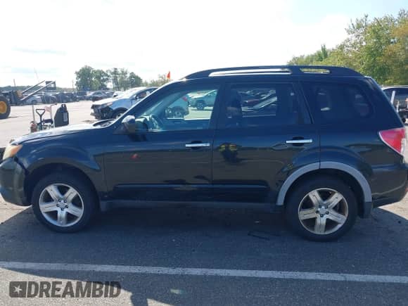 2009 Subaru Forester X with VIN JF2SH63689H734681, listed as a IAAI auction lot 43310176 with 296,187 mi miles and . Bid and sale history available at DreamBid. Image 14.