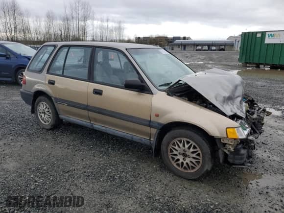 1990 Honda Civic with VIN JHMEE2754LS010638, listed as a Copart auction lot 85169464 with 167,566 mi miles and Salvage title. Bid and sale history available at DreamBid. Image 4.