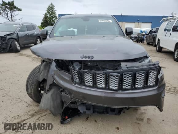 2018 Jeep Grand Cherokee Laredo with VIN 1C4RJFAG2JC179354, listed as a Copart auction lot 57806255 with 128,968 mi miles and Clean title. Bid and sale history available at DreamBid. Image 5.