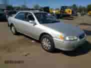 2001 Toyota Camry LE z VIN JT2BG22KX10598722, wystawiony jako Copart lot #84900455 z przebiegiem 153 570 mil mil oraz Szkoda całkowita • Salvage title. Historia ofert i sprzedaży dostępna na DreamBid. Obrazek 4.