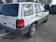 1995 Jeep Grand Cherokee Laredo with VIN 1J4GZ58Y2SC582464, listed as a IAAI auction lot 43330659 with 210,650 mi miles and . Bid and sale history available at DreamBid. Image 4.