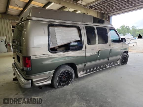 2002 Ford Econoline Cargo Recreational with VIN 1FDRE14L42HB76262, listed as a Copart auction lot 66448265 with 99,825 mi miles and Salvage title. Bid and sale history available at DreamBid. Image 3.