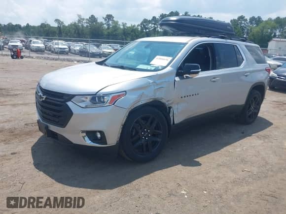 2019 Chevrolet Traverse LT Cloth z VIN 1GNEVGKW0KJ157212, wystawiony jako IAAI lot #42800696 z przebiegiem 84 825 mil mil oraz . Historia ofert i sprzedaży dostępna na DreamBid. Obrazek 2.