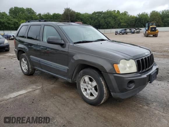2005 Jeep Grand Cherokee Laredo with VIN 1J4GS48KX5C563594, listed as a Copart auction lot 69724645 with 189,716 mi miles and Salvage title. Bid and sale history available at DreamBid. Image 4.