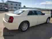 2009 Chrysler 300 LX with VIN 2C3KA43D49H577686, listed as a Copart auction lot 53002035 with 239,337 mi miles and Salvage title. Bid and sale history available at DreamBid. Image 3.