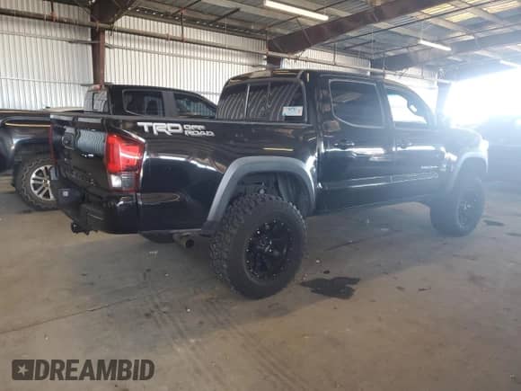 2016 Toyota Tacoma SR5 with VIN 3TMAZ5CN4GM003232, listed as a Copart auction lot 82364945 with 142,997 mi miles and Salvage title. Bid and sale history available at DreamBid. Image 3.