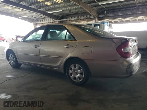 2002 Toyota Camry LE с VIN 4T1BE32K32U005811, выставлен на аукционе Copart как лот 70229945 с пробегом 209 472 миль миль и Чистый • Clean title. История ставок и продаж доступна на DreamBid. Изображение 2.