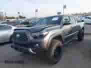2021 Toyota Tacoma SR5 z VIN 3TMDZ5BN2MM108586, wystawiony jako IAAI lot #41604953 z przebiegiem 65 422 mil mil oraz . Historia ofert i sprzedaży dostępna na DreamBid. Obrazek 2.