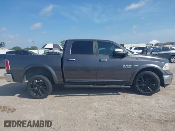2014 Ram 1500 Laramie with VIN 1C6RR6NT3ES172884, listed as a IAAI auction lot 42809114 with 233,024 mi miles and . Bid and sale history available at DreamBid. Image 13.