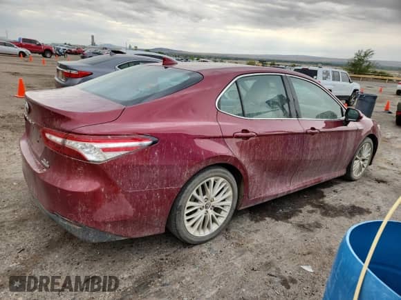 2019 Toyota Camry Hybrid LE с VIN 4T1B21HK0KU013577, выставлен на аукционе Copart как лот 69117375 с пробегом 99 364 миль миль и Списание • Salvage title. История ставок и продаж доступна на DreamBid. Изображение 3.